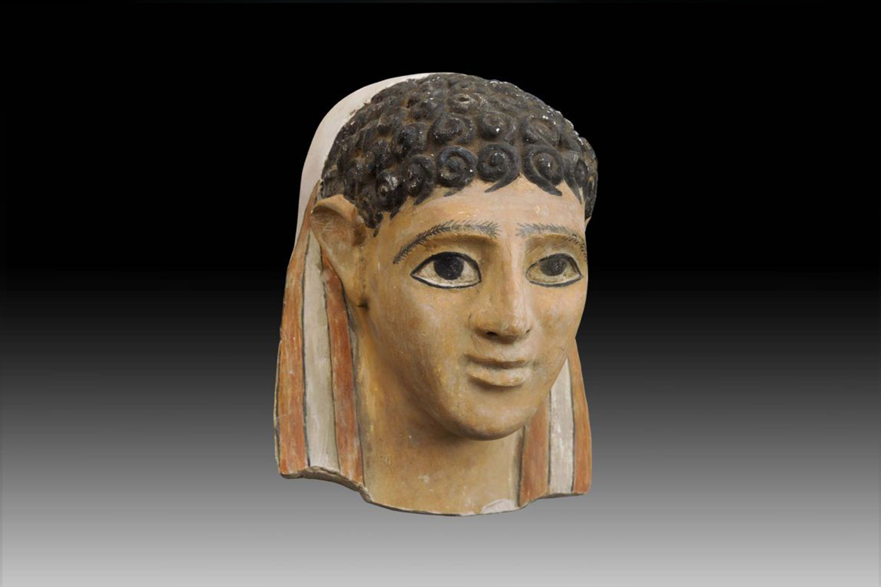 A Fine Egyptian Gypsum Mask of a Male Youth