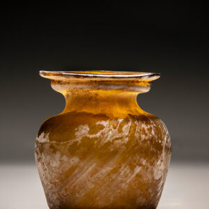 A Roman Amber Glass Jar with Diagonal Ribbing