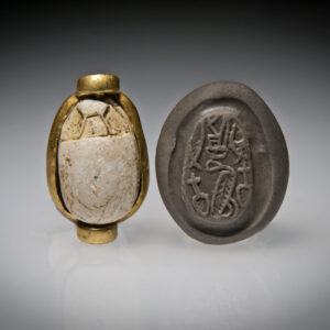 A Hyksos Steatite Scarab Engraved with a Cobra with a Red Crown and Hieroglyphs and a Gold Bezel