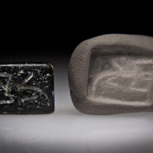 A Late Canaanite Andesite Double Stamp Seal with a Lizard and a Stag