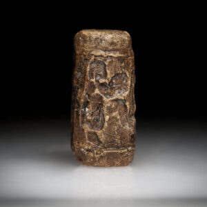 A Neo Sumerian Limestone Cylinder Seal Engraved with a Drinking Scene