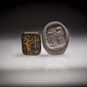 A Hematite Persian Stamp Seal with a Standing Figure in Front of a Palm